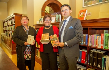 Consul General Abhishek Shukla presenting set of books for ‘India Corner’ in UCT Library